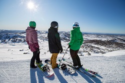 snowboarders admiring view